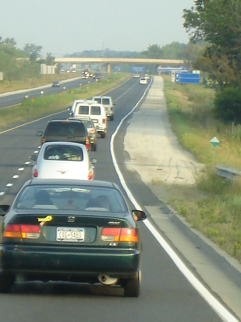 Our many cars heading up to the race site