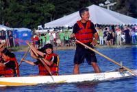 Jian looking at NSX boat (after we crossed the finish line!)